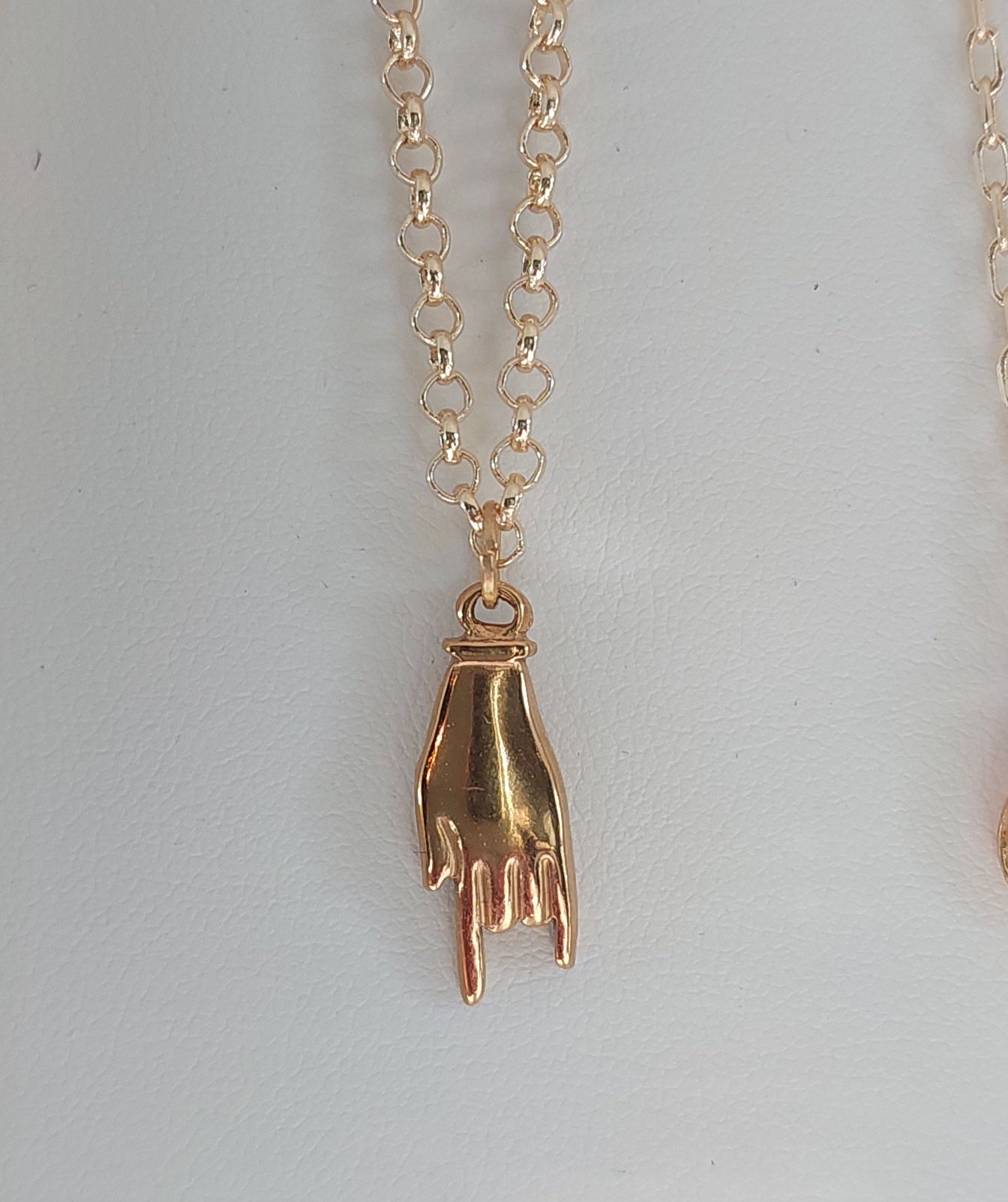 Golden hand necklace