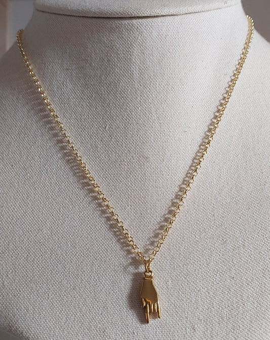 Golden hand necklace