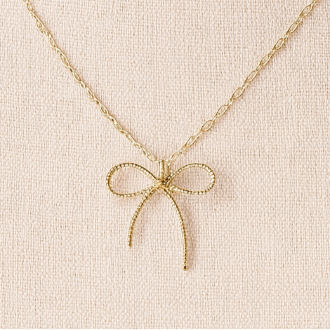 Gold bow necklace.